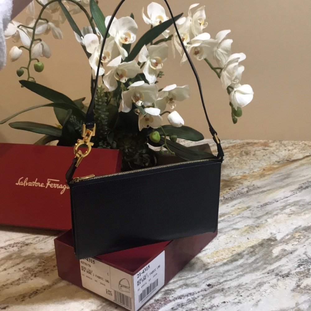small black Salvatore Ferragamo purse.